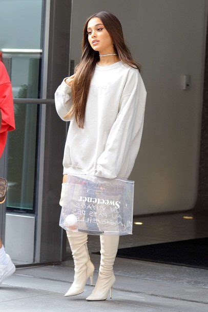 ariana grande sweatshirt and boots.